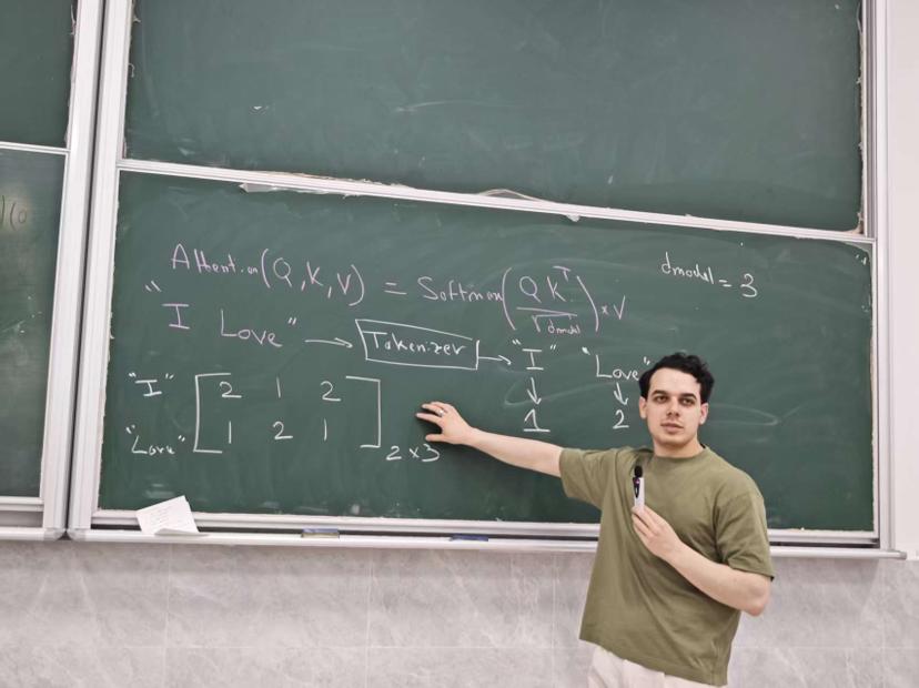 Sandro Zangiacomi teaching attention mechanisms at a blackboard